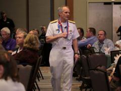 Adm. Phillip G. Sawyer, USN, commander, U.S. Pacific Fleet, walks among the audience as he gives Monday’s keynote luncheon address during TechNet Asia-Pacific 2015.