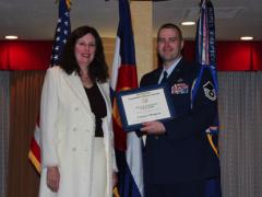 Dr. Merri Sanchez, chief science and technology adviser, Air Force Space Command, presents the AFCEA War Veterans Undergraduate Scholarship, Afghanistan and Iraq War Veterans, to Master Sgt. Vernon S. Thompson, USAF, at the Rocky Mountain Chapter’s May awards banquet.