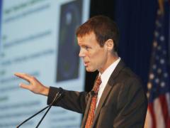 John Smart, president of the Acceleration Studies Foundation, tells the keynote luncheon audience that dramatic change is evolutionary and inevitable.