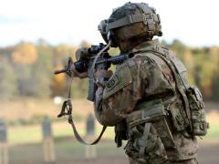 A soldier dons the prototypical Integrated Visual Augmentation System during a live fire test event at Fort Pickett, Virginia, in October 2020. The Silicon Anode Conformal Wearable Battery prototype is placed in the soldier’s back pouch. Army officials will assess two versions of the new battery during Project Convergence 2021 in October. Credit: Courtney Bacon, PEO Soldier PAO