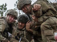 Soldiers from the Army’s 6th Ranger Training Battalion help a simulated wounded victim during a mass casualty exercise February 5 at Eglin Air Force Base, Florida. The service’s Fiscal Year 2021 Budget request seeks to support increased soldier lethality, readiness and modernization of capabilities. U.S. Air Force photo/Samuel King Jr.
