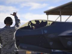 Master Sgt. Thomas Puckett, USAF, 7th Aircraft Maintenance Squadron, Lightning Aircraft Maintenance Unit section chief, sends off an F-35 Lightning II fighter jet assigned to the 6th Weapons Squadron at Nellis Air Force Base, Nevada. The Air Force has made the Shadow Operations Center at Nellis the location validating its Joint all-domain command and control. U.S. Air Force photo by Airman 1st Class Andrew Sarver