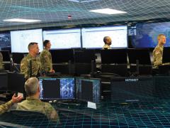 Cyber warriors with the National Guard are sometimes similar to colonial-era militiamen, fighting with whatever technological weapons they have at home or building the tools they need. Alexander Herasymchot/Shutterstock and U.S. Defense Department courtesy photo