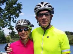 Andrew Loerch (r), an avid cyclist pictured with his wife Claire, contributed greatly to AFCEA NOVA’s George Mason University subchapter. Loerch was an associate chair of the Department of Systems Engineering and Operations Research at George Mason University. Photo courtesy of Pierce Funeral Home/Loerch family.