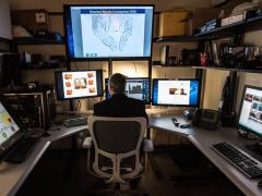 An HSI investigator works with facial recognition software. Photo courtesy U.S. ICE