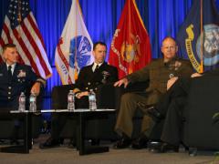 From l to r, service chiefs from the U.S. Coast Guard, Navy and Marine Corps address critical issues facing the U.S. military. Photo by Mike Carpenter
