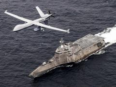 An MQ-9 Sea Guardian unmanned maritime surveillance aircraft system flies over the littoral combat ship USS Coronado in the Pacific Ocean in April, 2021, during U.S. Pacific Fleet's Unmanned Systems Integrated Battle Problem 21. At a recent conference, the fleet commander emphasized the need for trusted relationships and information sharing with allies and for long-range strike weapons. 