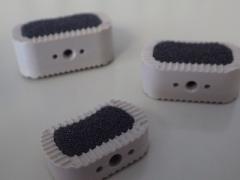 Prototype anterior lumbar interbody fusion (ALIF) implants are made with a carbon foam bone-graft substitute material and can be placed inside a patient’s spinal cage to aid in rapid fusion of the spine.