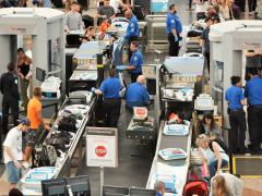 Travelers in long lines at Denver International Airport pass through Transportation Security Administration screening areas. Artificial intelligence software developed under an Intelligence Advanced Research Projects Activity program could help identify certain human behaviors. Jim Lambert/Shutterstock