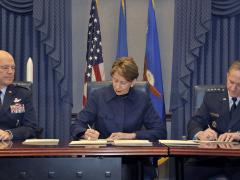 The U.S. Space Force will grow to about 16,000 warfighters, civilians and contractors. Top military leaders, including, Gen. John Raymond (l), commander of United States Space Command and Air Force Space Command; Secretary of the Air Force Barbara Barrett (c); and previous Chief of Staff of the Air Force Gen. David L. Goldfein, sign memorandums to authorize the service last December. Credit: Secretary of the Air Force Public Affairs, Photo by Tech. Sgt. Robert Barnett