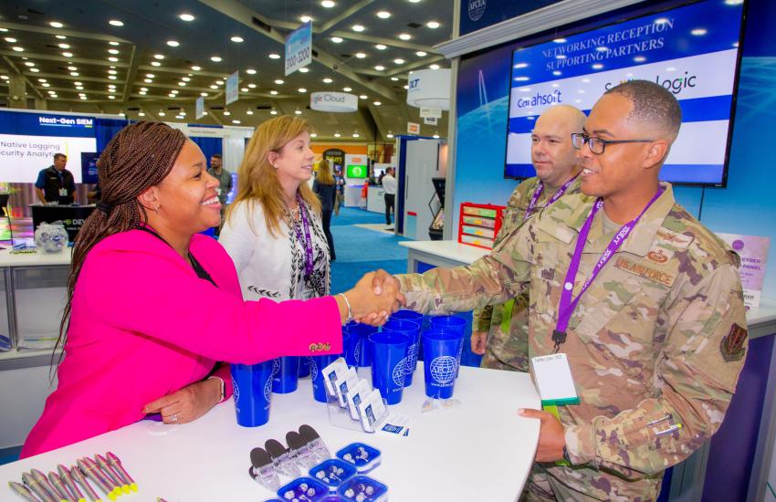 Greeting military individuals at AFCEA Membership booth