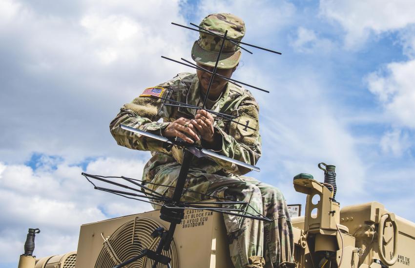 A U.S. soldier helps set up a tactical command post to test communications in Germany. Army researchers intend to push the limits of electromagnetic spectrum and enhance communications in part through the use of advanced antenna technologies.  Credit: Army photo by Sgt. Patrick Jubrey