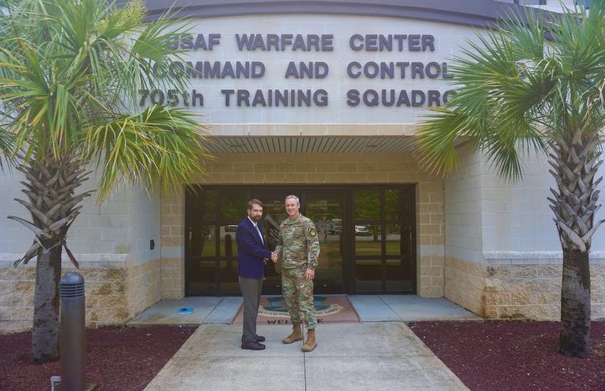 Col. Frederick Coleman, USAF, 505th Command and Control Wing commander, (r), and Jeff Reilly, chairman of the Department of Joint Education, Air Command and Staff College, discuss the Air Education and Training Command’s plan to incorporate Joint All-Domain Operations, or JADO, principles throughout all levels of education during Reilly’s visit to Hurlburt Field, Florida, in May 2022. Without the proper training of command and control at all levels, concepts like JADO will not succeed, says Col. Coleman.