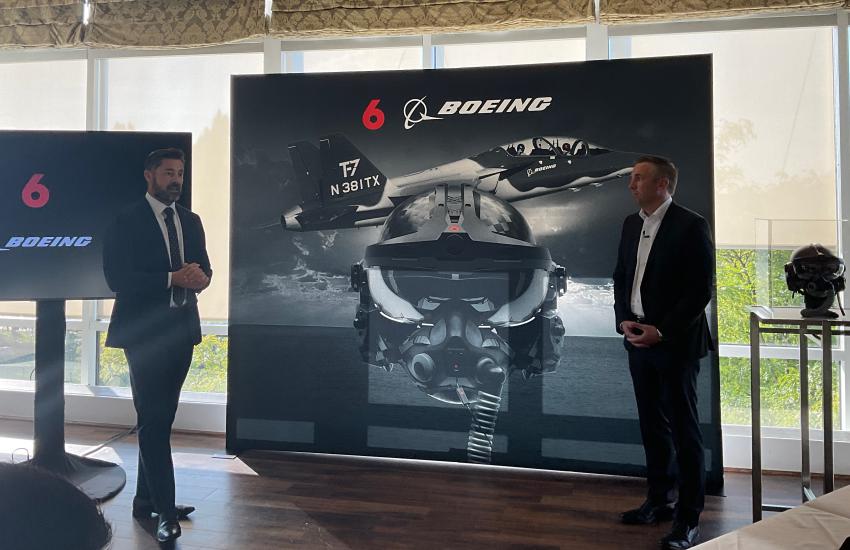 CEO and co-founder of Red 6 Daniel Robinson (l) speaks about the details of their Boeing partnership with Dan Gillian, vice president and general manager of U.S. Government Services at Boeing Global Services, yesterday at the Gaylord Resort, Maryland.