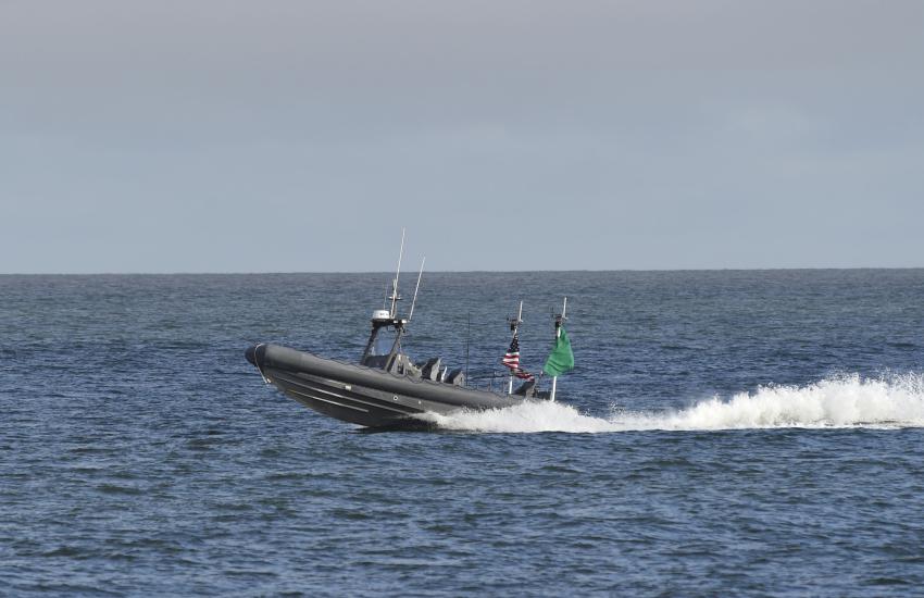 An unmanned rigid-hull inflatable boat operates autonomously during an Office of Naval Research (ONR)-sponsored demonstration of swarmboat technology held at Joint Expeditionary Base Little Creek-Fort Story. During the demonstration, four boats, using an ONR-sponsored system called CARACaS (Control Architecture for Robotic Agent Command Sensing), operated autonomously during various scenarios designed to identify, trail or track a target of interest. U.S. Navy photo by John F. Williams/Released