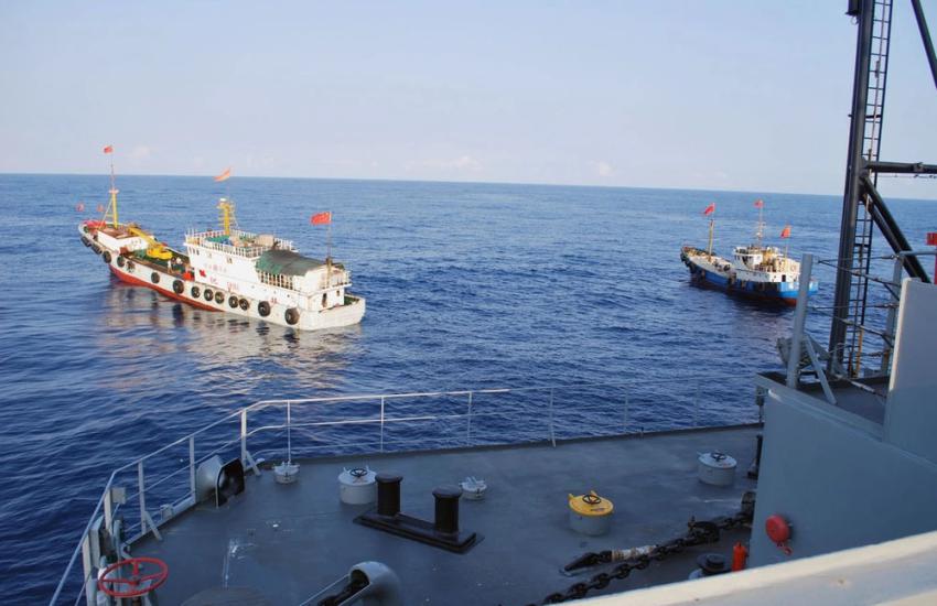 Two Chinese trawlers stop in front of the USNS Impeccable, forcing the ship to conduct an emergency “all stop” to avoid collision. The trawlers came within 25 feet of Impeccable. Credit: U.S. Navy