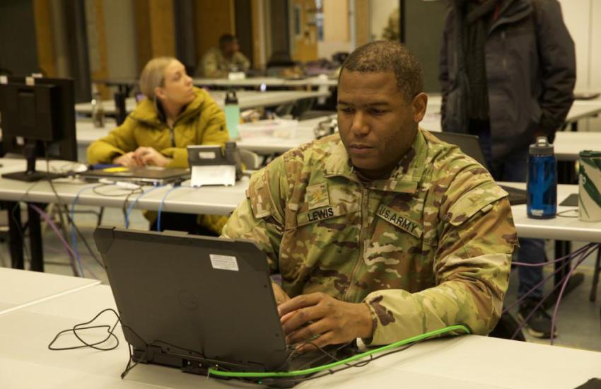 U.S. Army Maj. Michael Lewis, assigned to V Corps Headquarters, assists in controlling exercises for Winter Strike at U.S. Army Garrison Bavaria Grafenwöhr in December 2022. Winter Strike is a command post exercise that enables timely military mobility and decision-making to ensure our troops and equipment can respond to a crisis across Europe to assist allies without delay. Credit: U.S. Army photo by Pfc. Myenn LaMotta