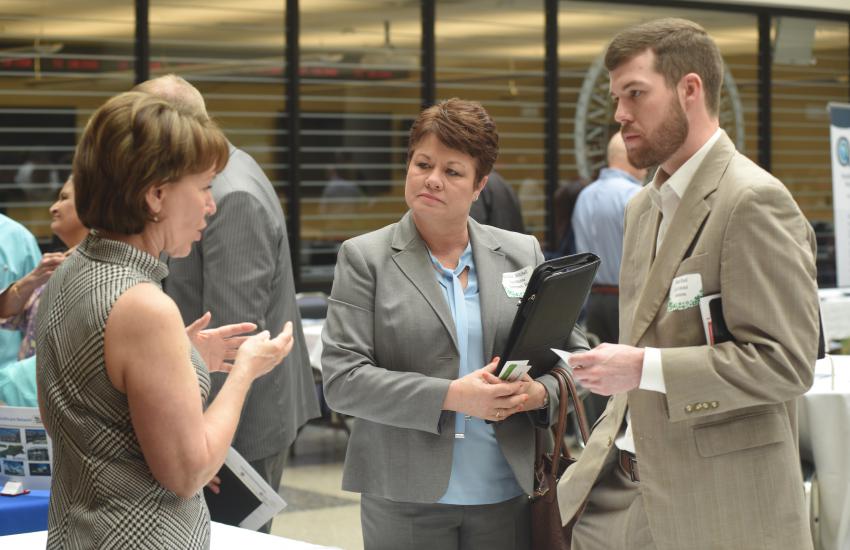 Linda Spadaro (Left), U.S. Army Corps of Engineers Mobile District Small Business Office chief, interacts with Melanie Mitchell, Aqua Marine Enterprises, Inc., and Matt Reed, GoToMarket Solutions, during a small business forum at Tennessee State University in Nashville, Tennessee. Photo: Leon Roberts, U.S. Army Corps of Engineers.