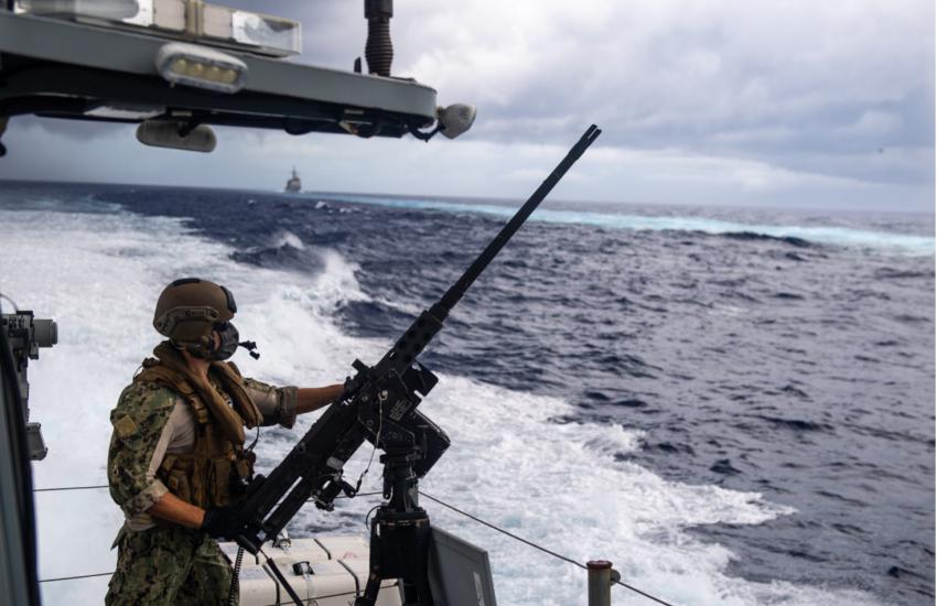 Engineman 2nd Class James Leyshon, assigned to Coastal Riverine Squadron 3, mans a .50-caliber machine gun while aboard a Mark VI patrol boat in support of Valiant Shield 2020 in September 2020. Valiant Shield is a U.S. only, biennial field training exercise with a focus on integration of joint training in a blue-water environment among U.S. forces. Credit: U.S. Navy photo by Mass Communication Specialist 2nd Class Nick Bauer