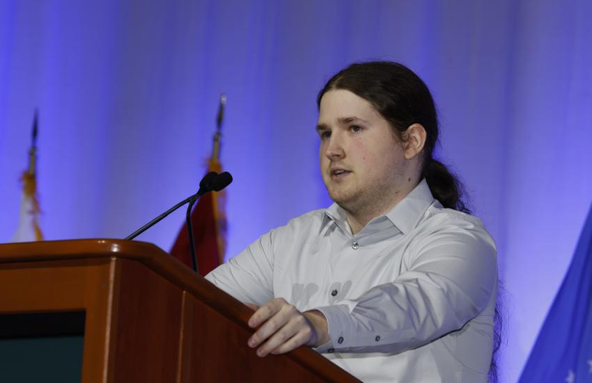 Gabe Solomon, a cloud engineer with DISA’s Hosting and Compute Center, speaks to the audience at TechNet Cyber 2023 about DISA’s Global Directory. Credit: Michael Carpenter