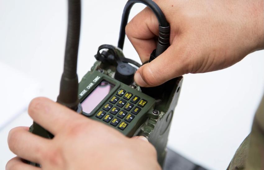 A Special Operations Soldier assembles a microphone during radio operator assessment while competing in the 8th Psychological Operations Group (Airborne) Best Squad Competition in May at Fort Liberty, North Carolina. The Army is exploring a radio-as-a-service concept, which will need to provide radio communications that are simple, resilient and redundant for operations in contested environments. Credit: U.S. Army photo by Sgt. 1st Class Venessa Hernandez