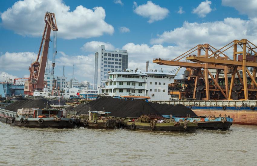 Rare earth elements and minerals are loaded on a cargo ship in China. Credit: tab62/Shutterstock