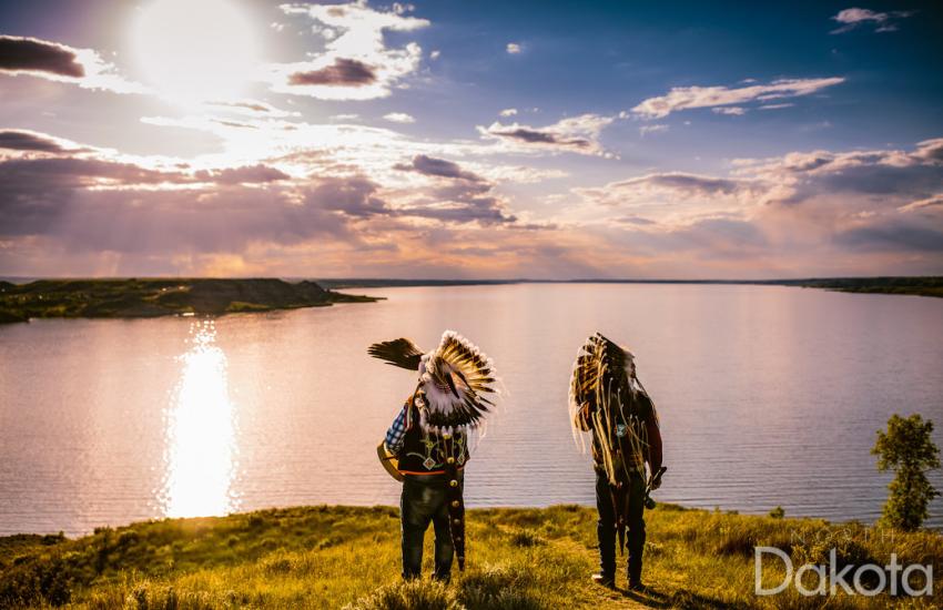 Mandan, Hidatsa and Arikara (MHA) Nation tourism representatives pose at Crow Flies High State Recreation Area, overlooking Lake Sakakwea, in North Dakota. The state’s unity of efforts cybersecurity approach is working to support tribal nations in the state, such as MHA, to improve their cybersecurity. Credit: North Dakota Tourism