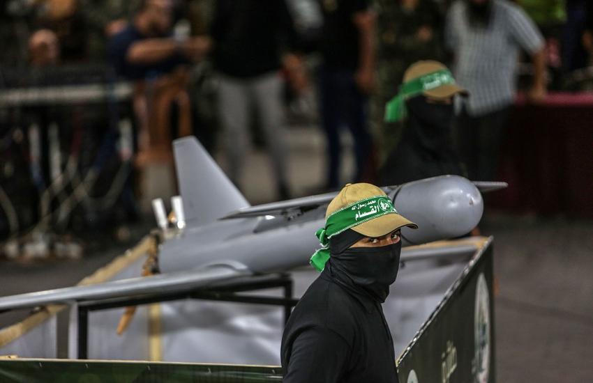 Hamas member stands next to a drone during a rally in Khan Yunis in the southern Gaza Strip in July 2022. Credit: Anas-Mohammed/Shutterstock