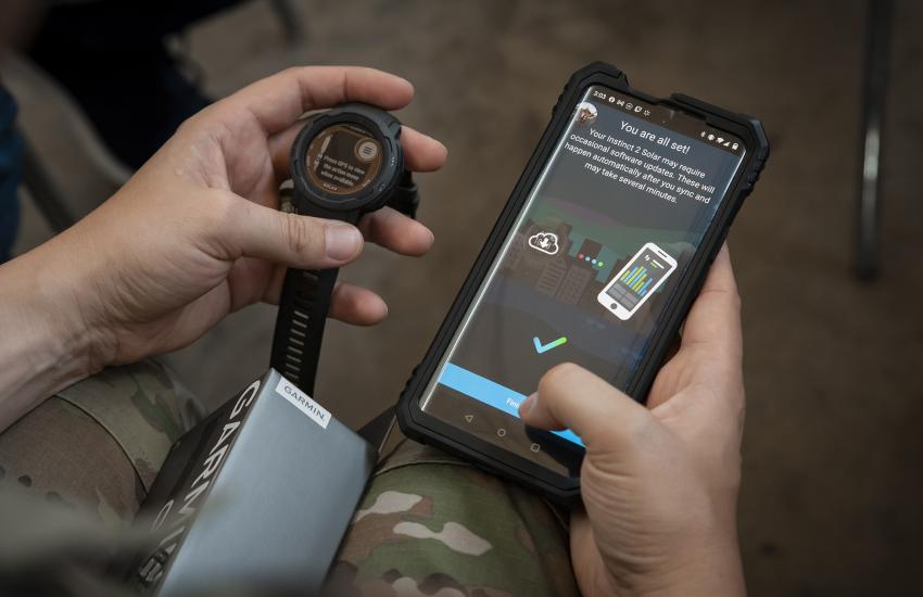 A Guardian syncs data from a wearable device to a phone during a Continuous Fitness Assessment (CFA) study informational session hosted by an Air Force Research Laboratory team at a facility near Wright-Patterson Air Force Base, Ohio, in June 2023. The CFA is part of the U.S. Space Force’s Holistic Health Approach. Credit: U.S. Space Force photo/Rick Eldridge