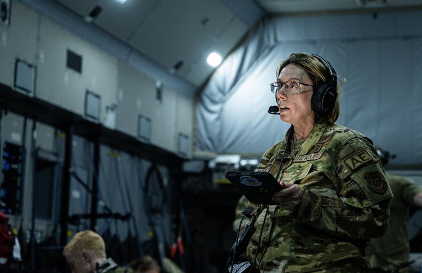 U.S. Air Force Lt. Col. Stephanie Ellenburg, 375th Aeromedical Evacuation Squadron commander, speaks to the AE crew during a joint medical training on a RAF A400M Atlas over Indo-Pacific Region, in July 2023, during Mobility Guardian 2023. MG23 is a multilateral exercise and an opportunity to train alongside allies and partners, increase interoperability and bolster collective ability to support a free and open Indo-Pacific. U.S. Air Force photo by Staff Sgt. Devin M. Rumbaugh