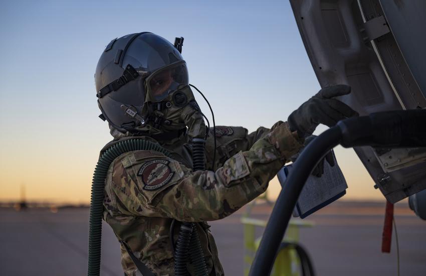 Staff Sgt. Christopher Diggs-Goff, 40th Airlift Squadron loadmaster, conducts preflight checks on a C-130J Super Hercules at Dyess Air Force Base, Texas, in January 2022. Sgt. Diggs-Goff conducted normal loadmaster and flying duties while testing the Two-Piece Undergarment universal integrative ensemble chemical, biological, radioactive and nuclear protective equipment. U.S. Air Force photo by Senior Airman Colin Hollowell