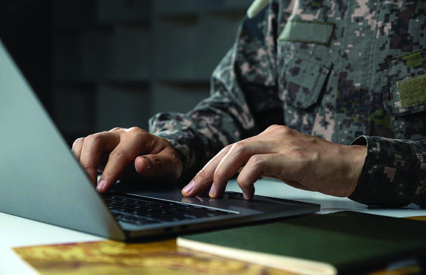 A soldier works in surveillance. Credit: Thx4Stock team/ Shutterstock