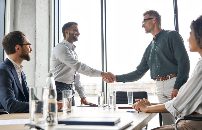Before the final handshake, compliance should include clear limits to classified data access. Credit: Ground Picture/Shutterstock