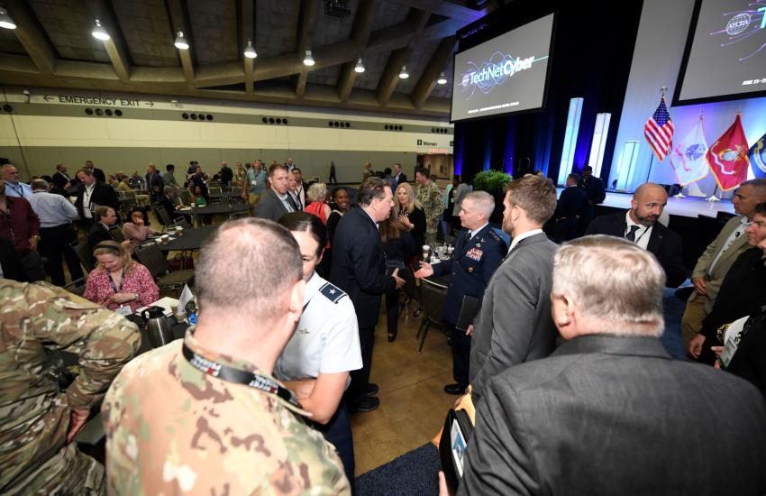 Gen. Timothy Haugh, USAF, commander, CYBERCOM, visits the exhibit hall at TechNet Cyber 2024.