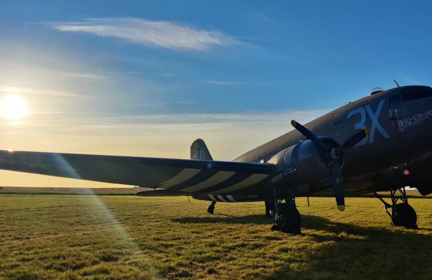 Historic aircraft on runway.