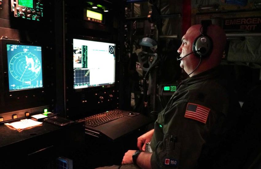 The squadron works in conjunction with the National Hurricane Center to relay data and information about a storm while flying through a hurricane’s eye. Senior Airman Donny Arseneaux, a loadmaster for the 53rd Weather Reconnaissance Squadron at Keesler Air Force Base, Mississippi, deploys an Airborne Expendable Bathythermograph from a WC-130J in August 2021. Credit: U.S. Air Force by Staff Sgt. Kristen Pittman