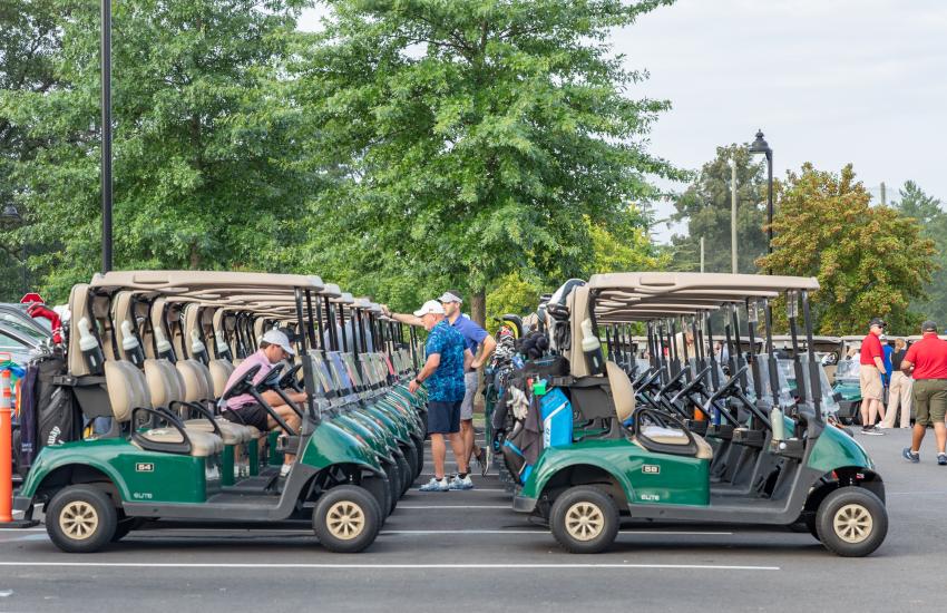 Golfers prepare for the tournament to start.