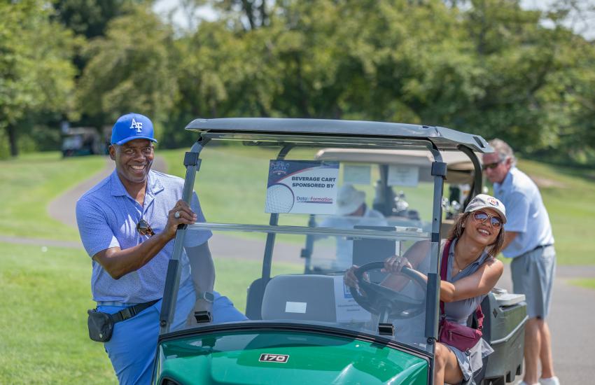 Riding around in a golf cart while raising money for STEM scholarships and teacher grants!