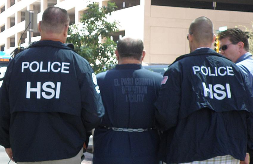 Homeland security agents arrest the subject of a child pornography investigation. Credit: Photo from DHS Flickr