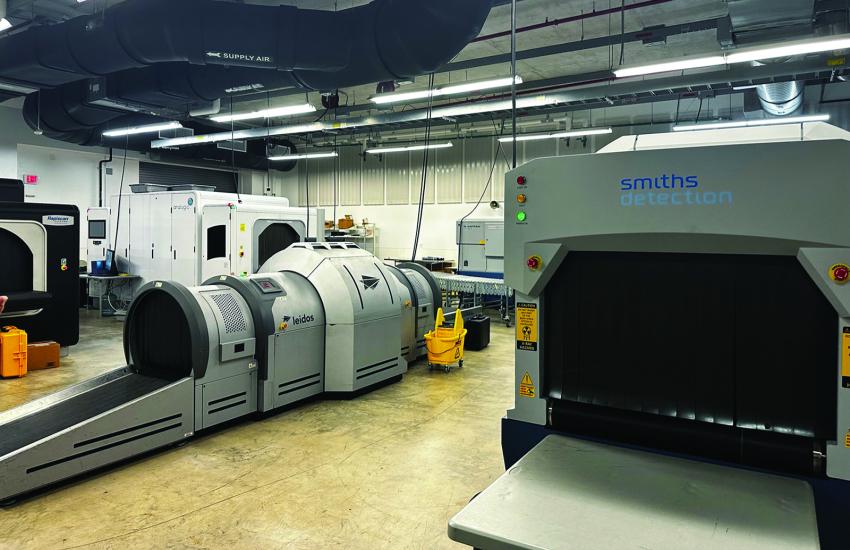 The lab is evaluating advanced scanners to be able to indicate the material properties about the contents of a passenger’s luggage.