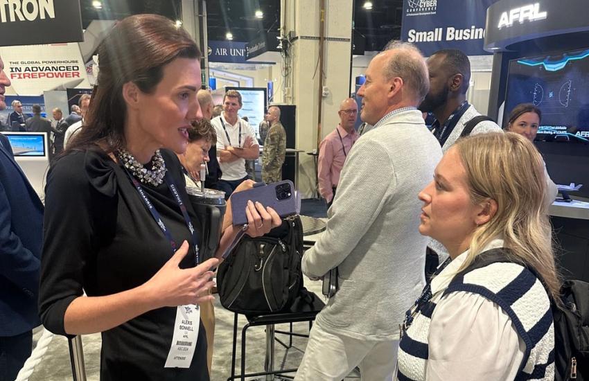 Alexis Bonnell (l), chief information officer and director of the Digital Capabilities Directorate of the Air Force Research Laboratory, speaks to an attendee at the Air, Space and Cyber Conference in National Harbor, Maryland, September 17, 2024. Amongst other efforts, Bonnell conducted research into how AFRL and the greater Air Force could benefit from artificial intelligence, and with senior leaders, has helped usher in the use of large language model experimentation and use at a wide scale. Marc DeNofio