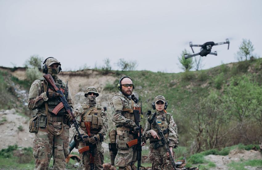 Local warfighters follow a drone at an undisclosed location in Ukraine. Credit: Dmytro Sheremeta/Shutterstock