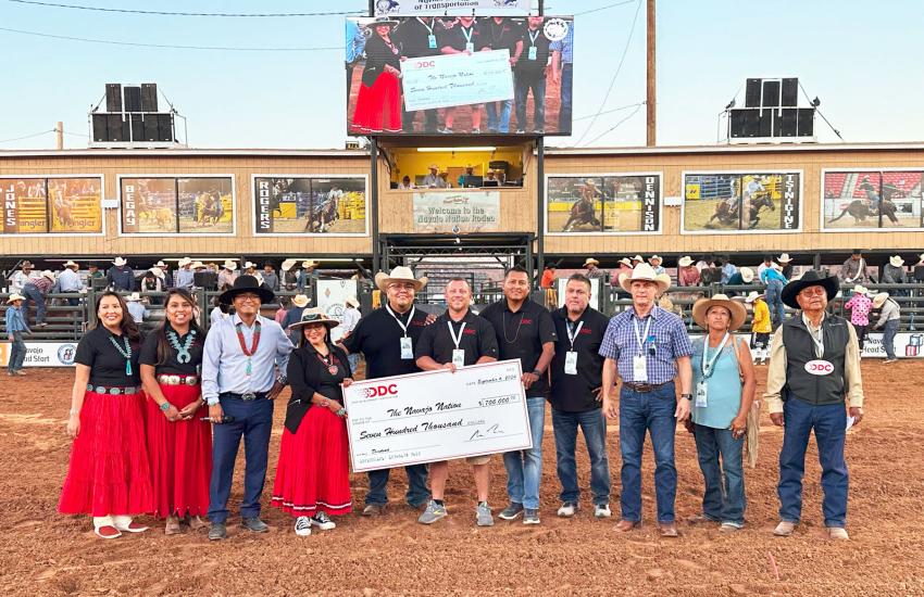 Tribal leaders point resources to address their community needs and to foster further business development. Pictured are Navajo Nation leaders accepting a $700,000 dividend check from Dine’ Development Corporation at the 76th annual Navajo Nation Fair in Window Rock, Arizona in September 2024 Credit: Dine’ Development Corporation