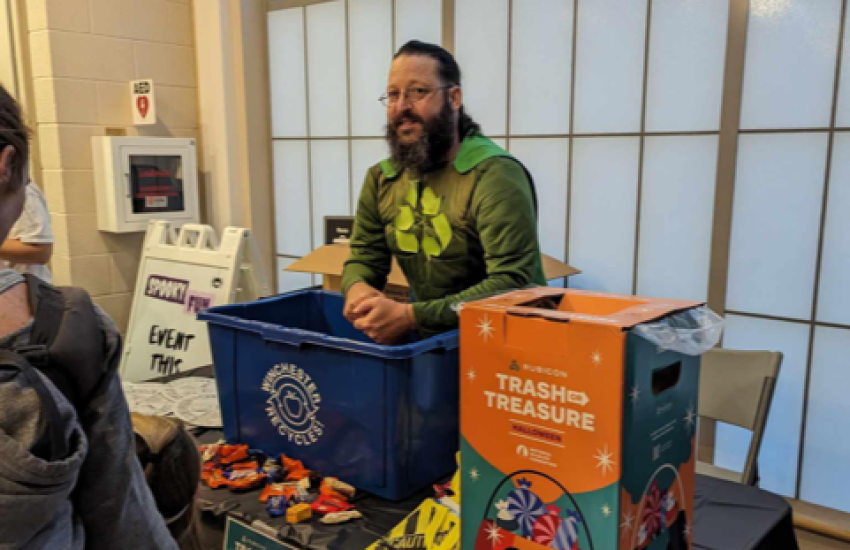 Michael Neese, aka “Michael Recycle,” talks to people in the community about how to recycle.