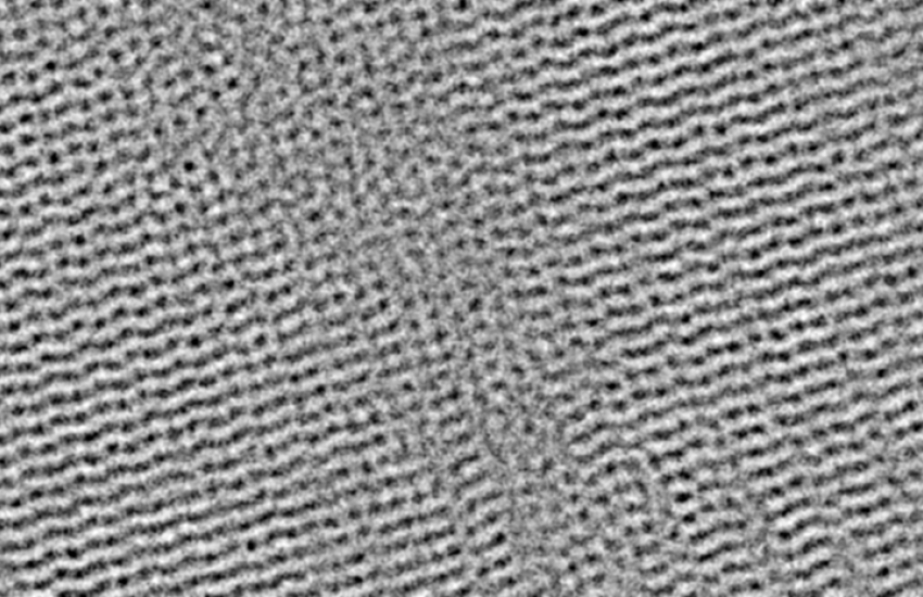 The microscopic structure of a two-dimensional, mechanically interlocked polymer captured using an advanced electron microscopy technique. Credit: David Muller, Schuyler Shi and Desheng Ma/Cornell University