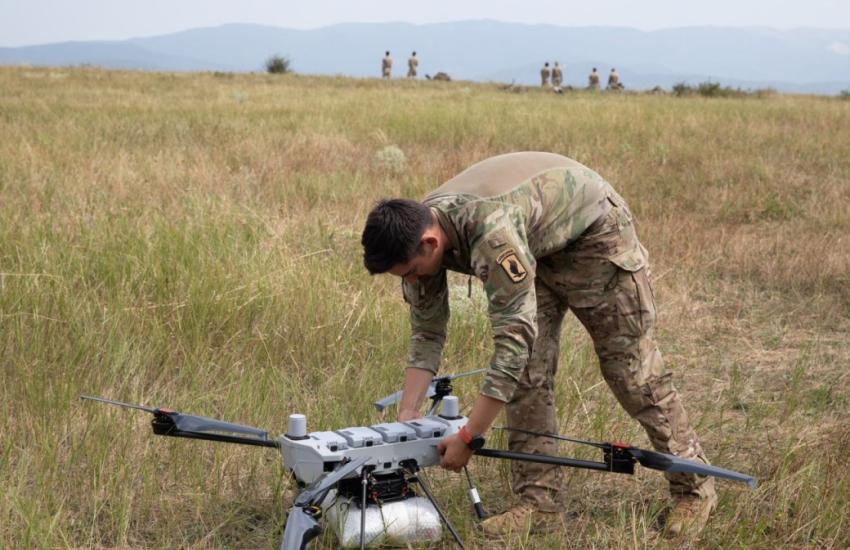 U.S. Army Spc. Tyler Dooros conducts preflight checks on the PDW C100 drone at Norio Training Area, Georgia, during Agile Spirit 25. Assigned to Hawkeye Platoon, Headquarters and Headquarters Troop, 1st Squadron, 91st Cavalry Regiment, 173rd Airborne Brigade, Dooros prepares the drone for a live demonstration of its aerial resupply and payload deployment capabilities using custom 3D-printed attachments. Credit: U.S. Army National Guard photo by Sgt. 1st Class Brittany Conley