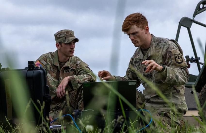 U.S. Army Sgt. Matthew Talty (l), and Capt. Timothy Naudet, both assigned to the 101st Airborne Division (Air Assault), train with the new Anduril Ghost-X Medium Range Reconnaissance (MRR) Small Uncrewed Aerial System (SUAS) at Fort Campbell, Kentucky, in May. The soldiers are working to integrate the Shrike Targeting Software with the Anduril Ghost-X MRR SUAS. Credit: U.S. Army photo by Pfc. Richard Ortiz