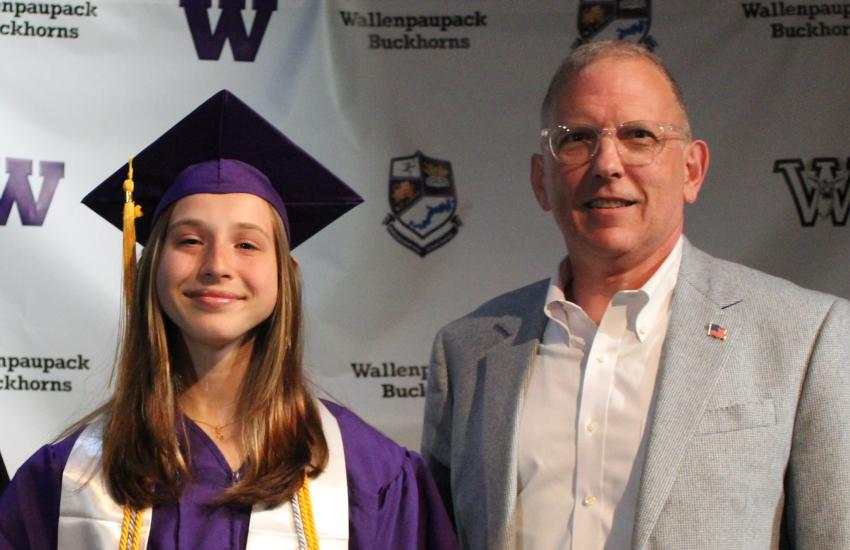 Alexis Blaszczyk (l) receives the 2025 Brad A. Logan Memorial Award, sponsored by Ray Cross (r), at the Wallenpaupack Area High School senior awards ceremony.
