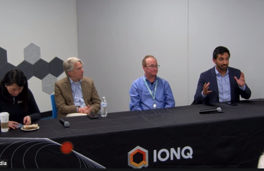 Quantum experts from IonQ, including Mihir Bhaskar (r), senior vice president for Global Research and Development; Denny Dahl (l), senior director for Field Engineering; and Curt Bujosa (c), technical program manager, speak about quantum information technology solutions at the Griffiss Institute in Rome, New York, on March 19.