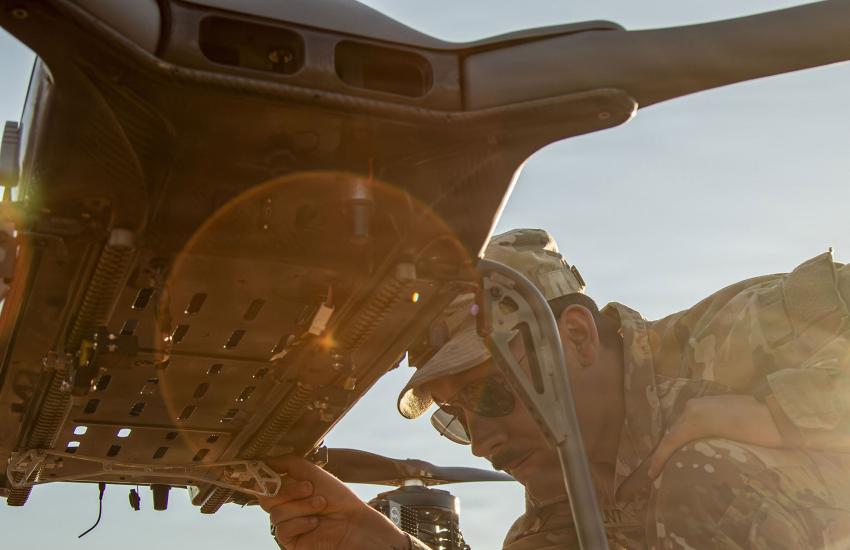 U.S. Army Spc. Austin Hunt, an unmanned aerial system operator, 703rd Brigade Support Battalion, 2nd Armored Brigade Combat Team, makes adjustments to a TRV-150 unmanned aerial system at Fort Stewart, Georgia, in February. If successful, the Defense Advanced Research Projects Agency’s Lift Challenge, taking place in August, could influence military and commercial unmanned system operations. U.S. Army/Staff Sgt. Anthony Herrera